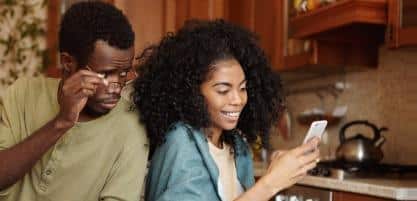 Woman reading messages on mobile phone